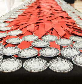 Excellence Awards medallions on table